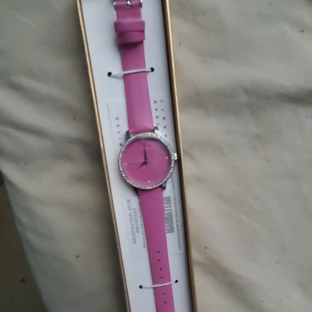 A bracelet with earrings and a watch